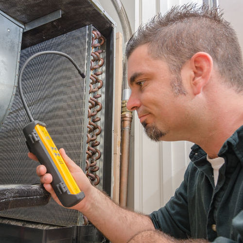 Commercial heating contractor tests furnace.