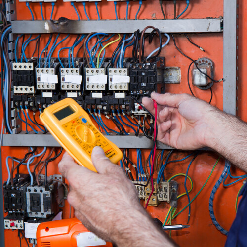 Electrician works on commercial wiring.